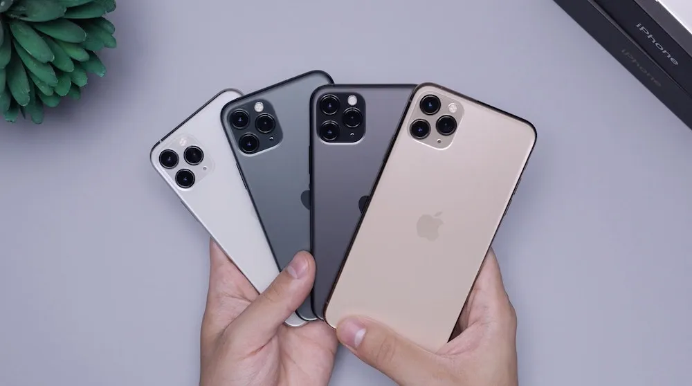 Four iPhone 11s are held together.