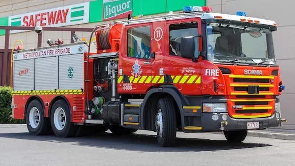 A red fire truck turns