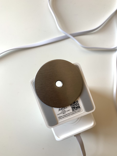 The magnetic ring-shaped magnetic mounting plate attached to the base of the wyze v3 camera