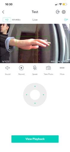 Wyze app live view with motion tracking following an outstretched hand