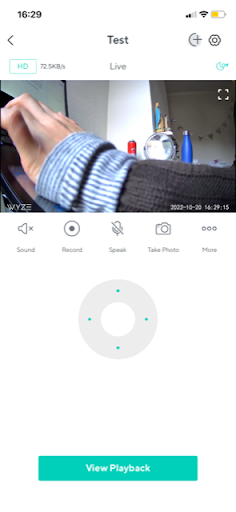 Wyze app live view where a close-up arm fills the frame and the face is lost