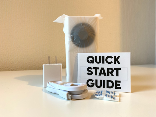 The Wyze Cam Pan v2 charging adaptor, mini USB cable, quick start guide, and the camera itself.