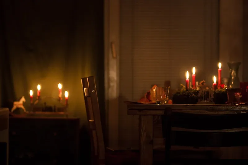 Lit candles are a dim source of ambient light in this image.
