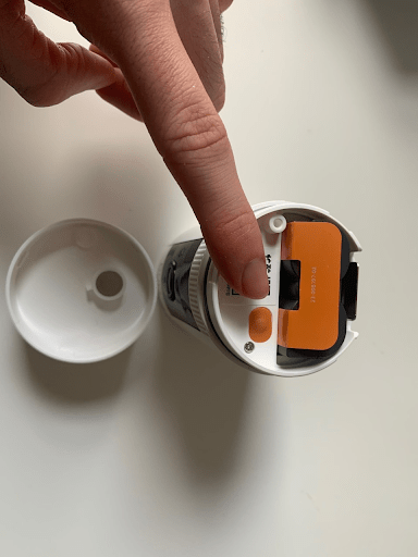 The QR code is inside the camera, beside the battery.