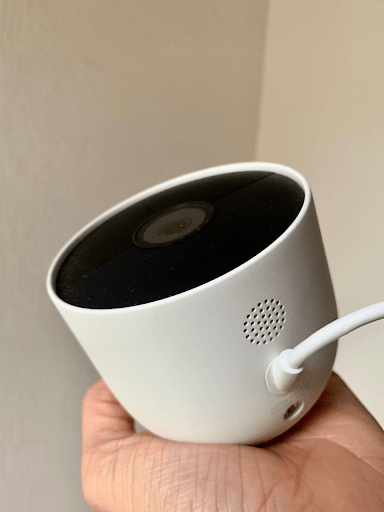 Google Nest Cam held by a hand