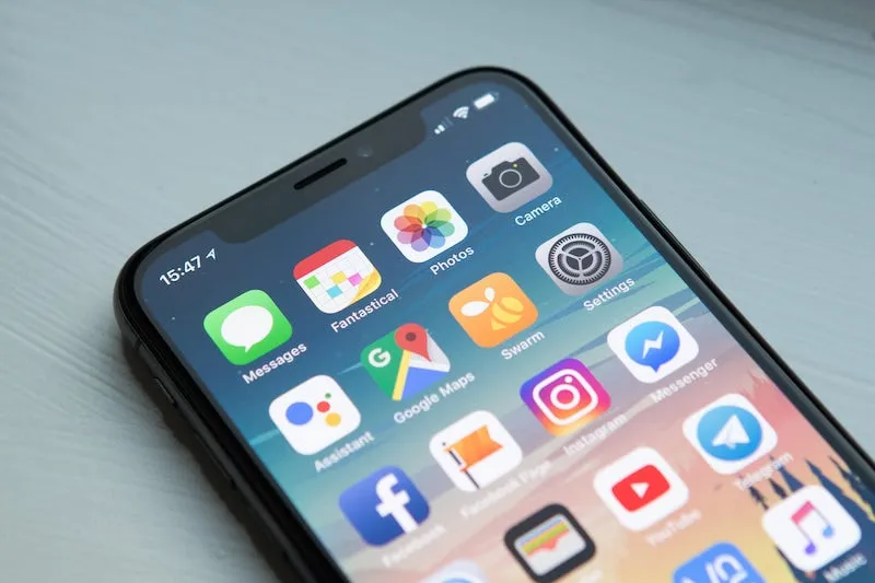 An iPhone home screen with apps including Google Maps, Messages and Instagram