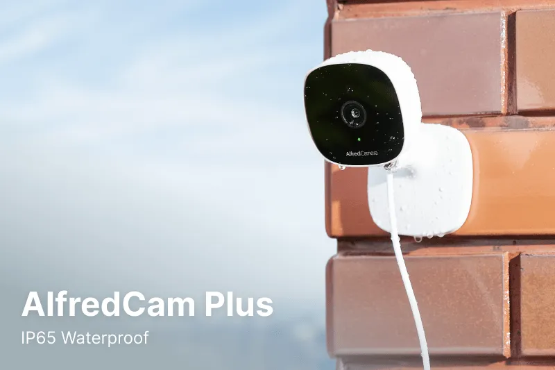 AlfredCam mounted to a red brick wall outdoor